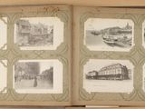 an open book with pictures of a city in it