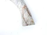 a large piece of metal that is sitting on a white surface