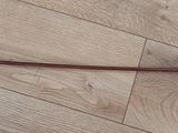 hardwood flooring with a wooden handle on it and a wooden floor