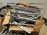 a pile of screws and bolts in a cardboard box