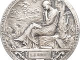 an image of a silver medal with a woman sitting on a bench