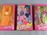 three barbie dolls are lined up in a row on a table