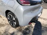 the rear end of a silver car parked in a parking lot