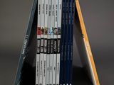 books stacked on top of each other on a gray surface