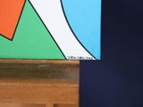 a picture of a painting on a easel with a blue background
