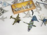 a lot of toy airplanes that are sitting on a table