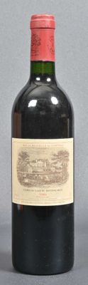 a bottle of wine that is sitting on a table