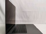 an open laptop computer sitting on top of a white surface