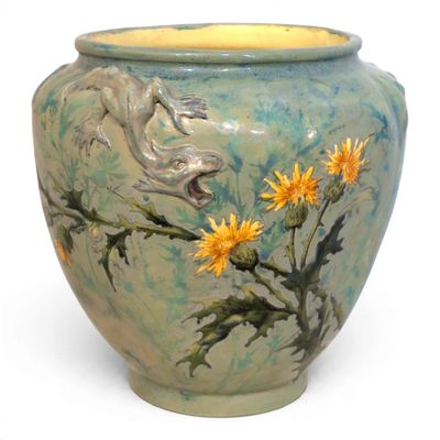a vase with a painting of a dog and flowers on it