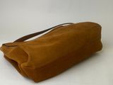 an image of a brown bag sitting on top of a white table