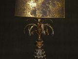 an image of a lamp with a gold shade on it