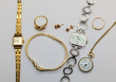 many different types of watches and bracelets on the table