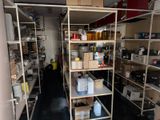a room filled with lots of shelves and containers