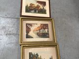 three framed pictures of trees and a river are on the floor