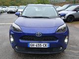 a blue toyota c - hr parked in a parking lot