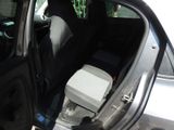 a car with the door open and the seat up