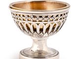 an image of a silver bowl on a stand on a white background