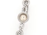 a close up of a wrist watch with diamonds on a white background