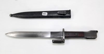 a knife and a knife holder on a white surface