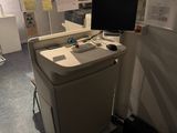 an image of a computer desk with a monitor on it