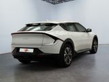 a white car that is parked in a room