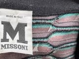 the label on the back of a dress with a pattern on it