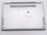 a silver laptop with a broken screen on a table