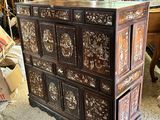 a large chest of drawers in the middle of a room