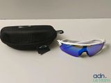 sunglasses and case on a white table with a black bag