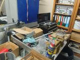 a cluttered room with a lot of clutter on the shelves