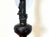 a lamp that is on top of a wooden table