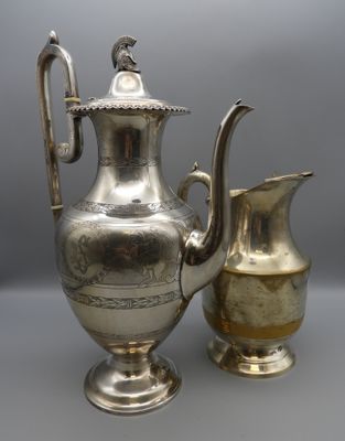 an antique silver plated coffee pot and a silver plated pitcher