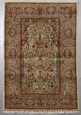 an antique persian rug with a floral design and fringe fringes