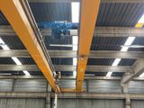 a crane that is hanging from the ceiling of a building