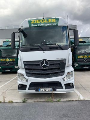many trucks that are parked in a parking lot