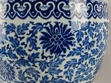 a blue and white vase sitting on a table