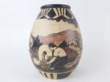 a black and white vase with a painting on it