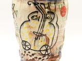 a vase that has a picture of a boat on it