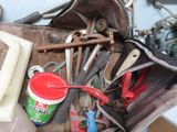 a bag full of tools sitting on top of a table