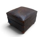 an old suitcase that is sitting on a white surface