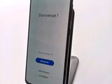 a phone that is sitting on top of a stand