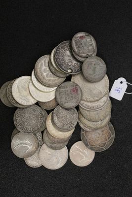 a pile of coins with a price tag on top of it