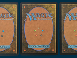 three decks of magic the gathering are shown in three different positions