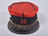 an image of a red and black hat with the number 32 on it