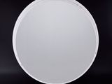 a picture of a white circular mirror on a black background