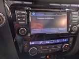 a radio in the center of a car with a blue screen