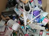 a cardboard box filled with lots of different types of toothbrushes