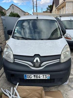 the white van is parked on the side of the street