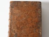 an old book that is sitting on a table