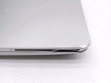 a close up of a silver laptop on a table